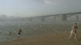 Dramatic storm Freak Russian hailstorm sends beachgoers screaming on hot summer day [upl. by Dolora]