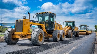 A group of new foundation construction machines is working together to grade and compact a road [upl. by Kcinomod]