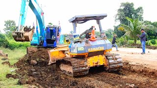 Very good team work of dozer and excavator to cleaning dirt road before making new road [upl. by Melisenda]