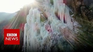 Frozen waterfalls form on Chinas Tianmen Mountain  BBC News [upl. by Lorolla]