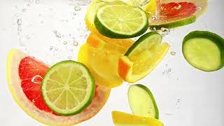 Mix of various citrus fruit slices in round pieces and thrown in water to make healthy lemonade [upl. by Amethyst]