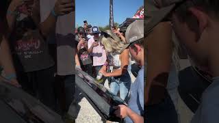 Lindsay Bercosky signing a tail gate with an angle grinder automobile [upl. by Alleynad]