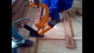 Nailing solid wood floor boards down with a floor nailer [upl. by Benilda]