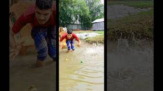 The boy is spearing fish in the waterfish fitnessmotivation fishing fifa finance shorts reels [upl. by Ahselaf60]