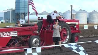 Nickerson Farmers Tractor Pull Classic First hook with the IH 1256 in the 10700lbs Farm Stock [upl. by Ylloh]