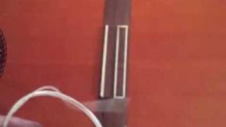 How to put strings on a classical guitar  a close up [upl. by Tiebout]