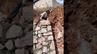 Stone concrete retaining wall construction process [upl. by Suehtomit]