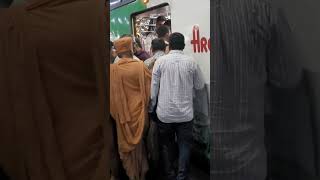 Diwali prayer by BAPS Santo traveling in Mumbai Local train at devotees Home Mahant Swami SherArtha [upl. by Ahsinyt121]