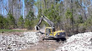 140 Volvo Excavator placing stone [upl. by Yboc]