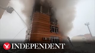 Firefighters battle blaze in Ukraines Odessa after Russian airstrike on residential building [upl. by Lrig963]