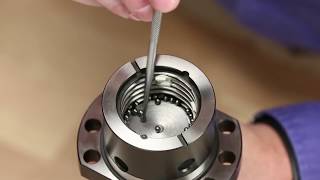 How to reload Ball Bearings into a ball nut Demonstrated using a nut with button returns [upl. by Wilkens]