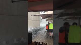 Workers Take Cover Under Umbrella as Hailstorm Smashes Canberra [upl. by Alracal118]