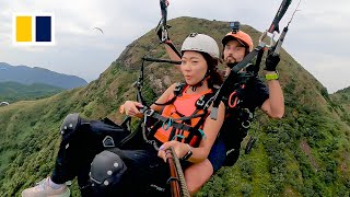 Paragliding offers birds eye view of Hong Kong [upl. by Aierdna114]