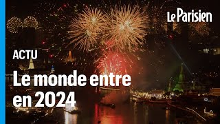 Entre feux d’artifice et roquettes le monde célèbre le passage en 2024 [upl. by Ahsien]