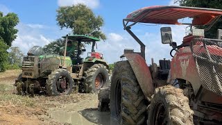 Tractor john deere pulls a Kubota tractor in the mud [upl. by Adlei]