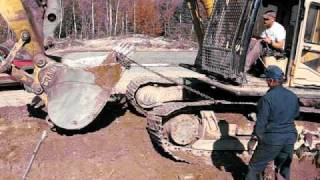 How to get the track back on the excavator [upl. by Thgiwed]