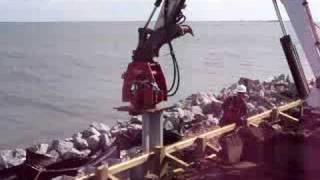 Compactor Plate Driving Everlast Seawall in North Carolina [upl. by Darum585]