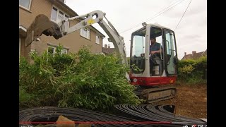 Digging out a driveway with a mini digger Takeuchi TB216 Excavator [upl. by Ardelle]