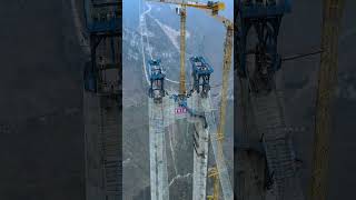 Chinas heavendefying project Huajiang Gorge Bridge completed its first steel truss hoisting on [upl. by Atterual]