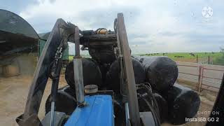 Insta360 GO 2 on a tractor  Stacking bales with a Ford 7810 [upl. by Enajiram]