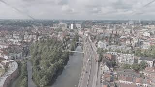 ALog Ghent Belgium Esco Scheldt river embankment Panorama of the city from the air Cloudy [upl. by Finley190]