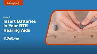 How to Insert Batteries in BTE Hearing Aids  Beltone [upl. by Lanrev]