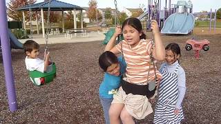 Kid Gets Stuck on a toddler Swing Set FUNNY  美国小姑娘被困在蹒跚学步的秋千上 [upl. by Solram]