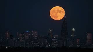 SuperMoon Glows as It Rises Over Chicago Skyline [upl. by Rexfourd]