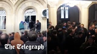 AntiRussia protesters storm parliament in Georgian breakaway region of Abkhazian [upl. by Rabelais665]