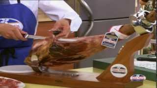 How to Carve Iberico Ham from wwwfoodsofspaincouk  Spanish Food Online [upl. by Nwahser]