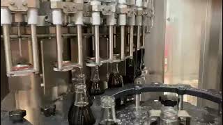 NEW INSTALLATION Filling capping monoblock for CSD and carbonated water in GLASS bottles [upl. by Lovell194]