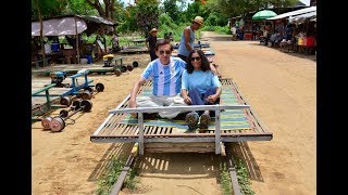 Antonio and Carlina de la Cova ride the original Battambang Bamboo Train in Cambodia June 5 2017 [upl. by Beulah837]