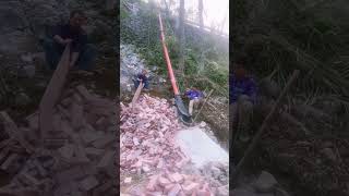 The process of unloading bricks down the hillside [upl. by Nivrac]