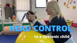 Facilitating head control to a dystonic quadriplegic child with cerebral palsy NDT intervention [upl. by Ynetruoc]