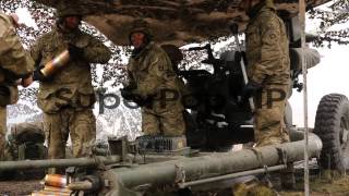 Royal Artillery gunners fire their 105mm light guns durin [upl. by Enyamart189]