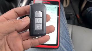 Add smart key OTOFIX watch Mitsubishi Triton 2016 By Autel KM 100 [upl. by Gayner]