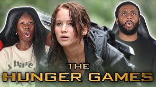 OUR FIRST TIME WATCHING THE HUNGER GAMES  MOVIE REACTION [upl. by Anotyal]