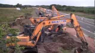 Balfour Beatty demolishes M8 bridge to create junction [upl. by Eldrida]