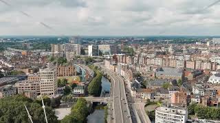 Dolly zoom Ghent Belgium Esco Scheldt river embankment Panorama of the city from the air C [upl. by Assirralc]