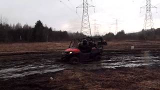 Honda Pioneer 7004 throwing mud in the rain [upl. by Erodroeht396]