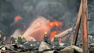 Firefighters douse flames after explosion at plastics factory near Bangkok  AFP [upl. by How17]