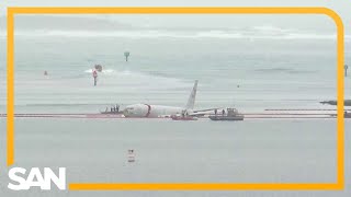 US Navy plane overshoots runway in Hawaii lands in the water [upl. by Idieh161]