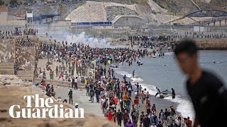 Migrants met by Spanish military as they swim to north African enclave Ceuta [upl. by Aened]