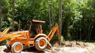 Case 580K Backhoe Clearing Trees [upl. by Rammaj]