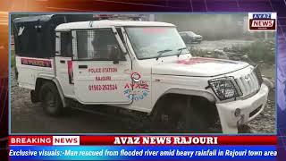 Exclusive visualsMan rescued from flooded river amid heavy rainfall in Rajouri town area [upl. by Ordnajela557]