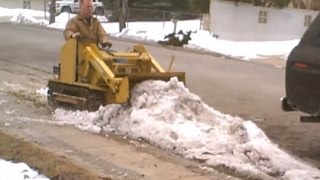 Mini BullDozer Magna Trac Junior moving ice amp snow [upl. by Entruoc]