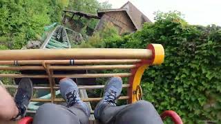 Gsengte Sau bobsled coaster at Tripsdrill in Germany Intertwined with building and logflume POV [upl. by Arabeila901]