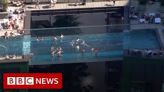 Worlds first floating pool suspended between London tower blocks  BBC News [upl. by Aramoy]