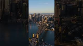 Sydney Harbor Bridge illuminated at sunrise [upl. by Eatnahs782]