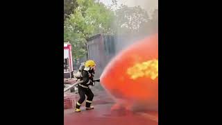 A firefighter used a quotwater shieldquot to repel the fierce flames Video by Peoples Daily [upl. by Adnarb16]